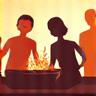 Family and friends gathered around an outdoor kitchen laughing and enjoying themselves.